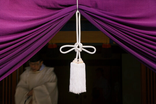 Asia, Japan, Honshu, Kansai Region, Kyoto, Fushimi-Inari Taisha shrine, detail of the entrance to one of the shrine buildings - detail of Shimenawa or sacred rope hanging over the entrance