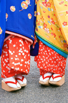 Asia, Japan, Honshu, Kansai Region, Kyoto, detail of two Geisha's - low angle detail of Kimono and Geta (high wooden shoes)