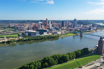 Fototapeta na wymiar Aerial photo of blue skies over Cincinnati, the Ohio River, Covington Kentucky and Newport.
