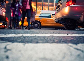 Activity in NYC with taxies and pedestrians