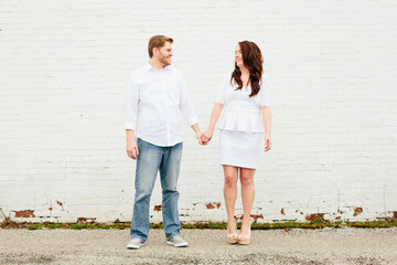 white couple holding hands