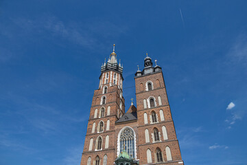 historic church in the old town square in krakow, poland on a summer holiday day