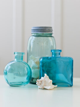 Glass bottles and shell