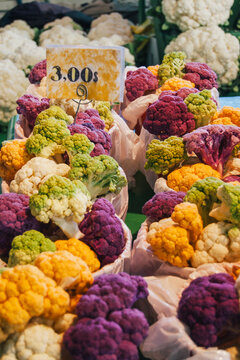 Variety of colors of cauliflower at market