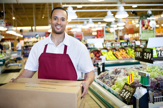 Supermarket: Happy Employee with Produce Box