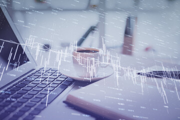 Double exposure of financial chart drawing and desktop with coffee and items on table background. Concept of forex market trading
