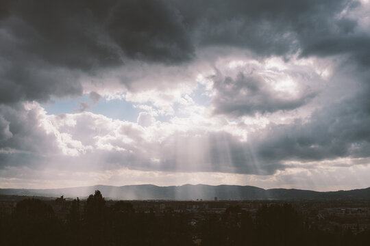 God rays beaming down on the valley in Tuscany