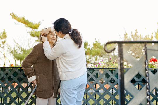 Homecare Nurse Connecting with Elderly Patient