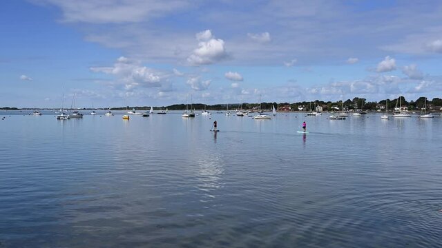 Stand Up Paddle Boards with Yachts and Boats on the water at Emsworth