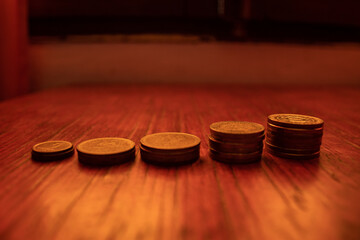 Argentine money of different value on a wooden cabinet. Argentina currency