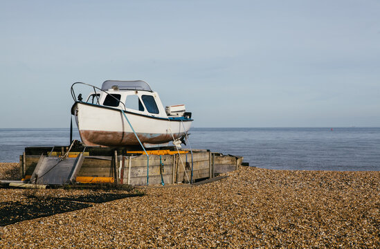 Fishing boat on an empty beach, Kent, UK.