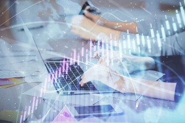 Fototapeta na wymiar Multi exposure of woman hands typing on computer and financial chart hologram drawing. Stock market analysis concept.