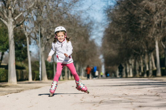 Little Girl Roller Skating in the Park