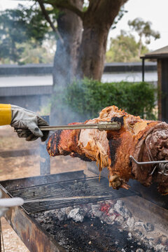 carving the spit pork roast