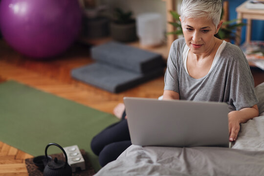 Woman Using a Laptop at Home