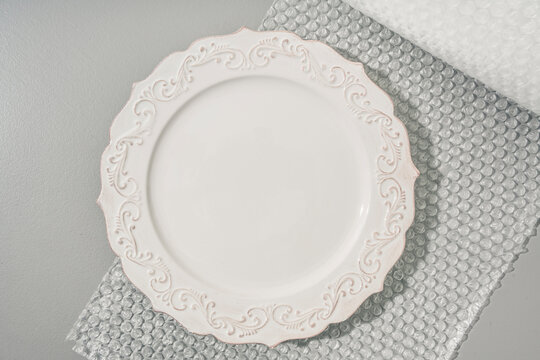 Ceramic Plate Being Packed for Shipping