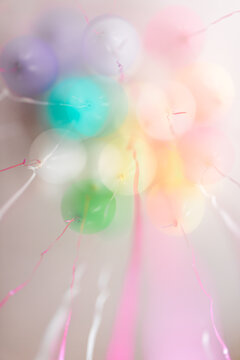 festive pastel balloons and ribbons -- multiple exposure