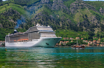 Kotor Bay with a cruise ship and mountains reflecting in Montenegro, Kotor