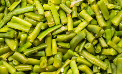 Green beans fried with onions close up texture. High quality photo