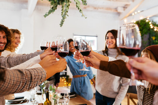 Big family proposing toast during holiday
