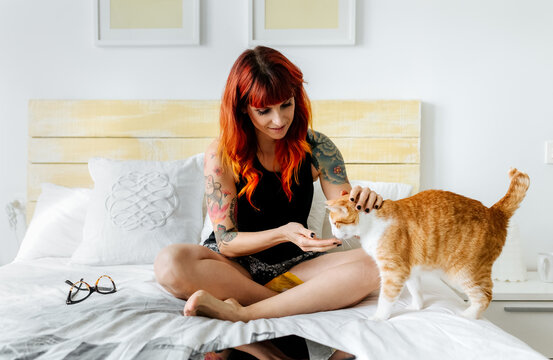 Young modern woman and her cat