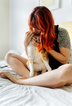 Young modern woman and her cat