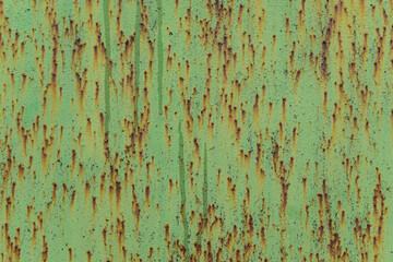 Fototapeta premium Old wall for the backdrop. The main paint color is Olivine. Point rust. Cracks, sagging, smudges, paint drops.