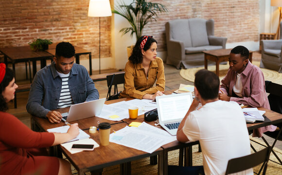 Multiracial startup team having meeting and working on project