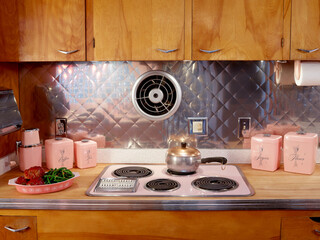 Vintage kitchen with a pink stove and wood countertop. Dallas, Texas.