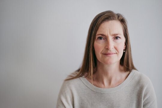 Portrait of mature, content woman looking peaceful at camera