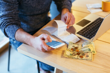 Anonymous man working and doing the numbers in office.