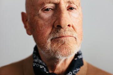 Elderly man looking at camera