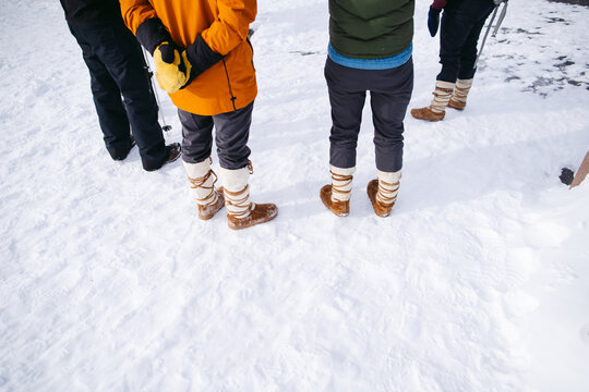 Friends hanging out in northern winter climate wearing mukluks.