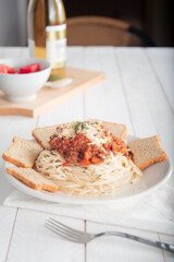Spaghetti bolognese white table background