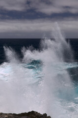 North coast of Gran Canaria, Canary Islands, Banaderos area, strangely shaped wave, resembling underwater explosion, 
formed by a clash of incoming and reflected waves