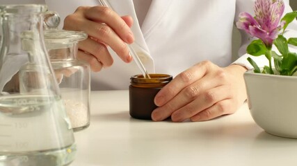 scientist making the natural skincare in the laboratory.