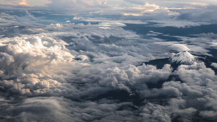 Fototapeta na wymiar Citlaltepetl volcano breaching clouds
