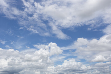 Blue sky with clouds background.
