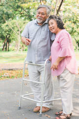 Happy elderly couple with lifestyle after retiree concept. Lovely asian seniors couple walking exercise in the park in the morning.