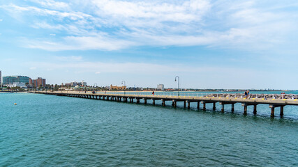 Fototapeta na wymiar St Kilda Beach is a beach located in St Kilda, Port Phillip, 6 kilometres south from the Melbourne city centre. It is Melbourne's most famous beach.