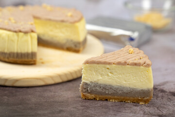 Homemade taro or yam cheese cake on wooden board