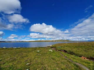 Landscape with the blue sky above the water - Hardangervidda 