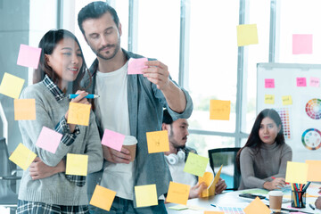 Brainstorming diversity creative design use post it sticky note  team meeting with startup teamwork. Collaborative brainstorm teams meeting with business partners share ideas teamwork in conference