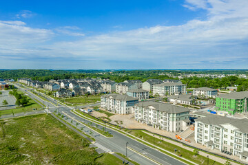 Fototapeta premium Aerial view of condo and apartment complex real estate building in a new development neighborhood street in the East Coast USA