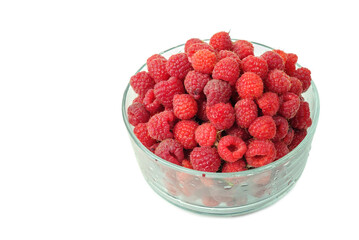 Fresh raspberries in a glass bowl on a white background