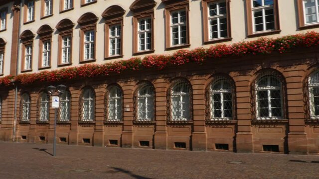 Heidelberg on a sunny morning in summer in the pedestrian zone downtown in the old town the city hall.