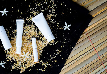 Cosmetic bottle packaging sets and facial treatments. White container of beauty products for...