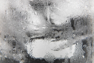 Condensation on glass of water with ice for background