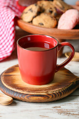 Cup of hot tea on table