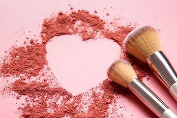 Makeup brushes and heart made of cosmetics on color background
